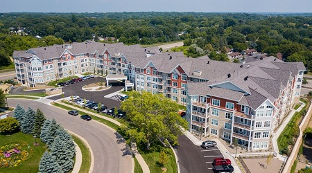 Aerial View large estate with cars