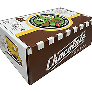 Chocolates in box wrapped in plastic with green bow